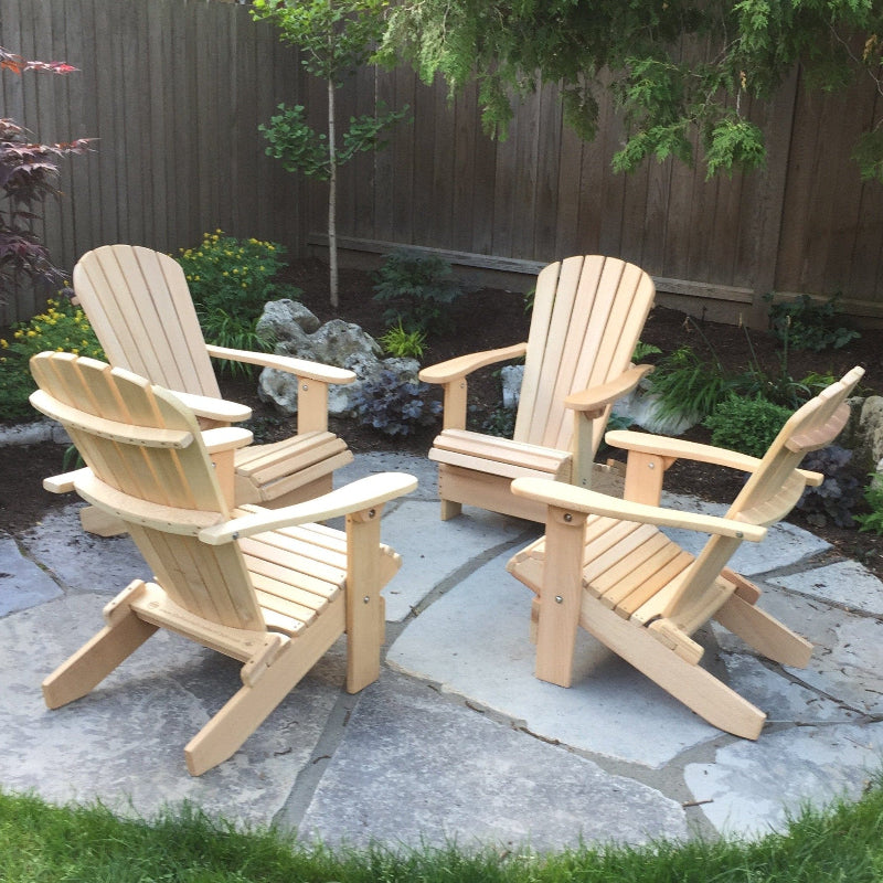 set of classic Adirondack chairs in backyard