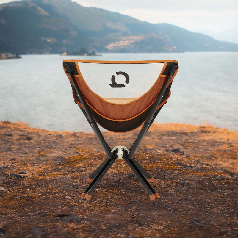 CLIQ ClassiQ 2.0 lightweight, portable chair in burnt orange on cliff