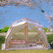 Cody 10.0 Pro premium canvas tent in beige set up near lake.
