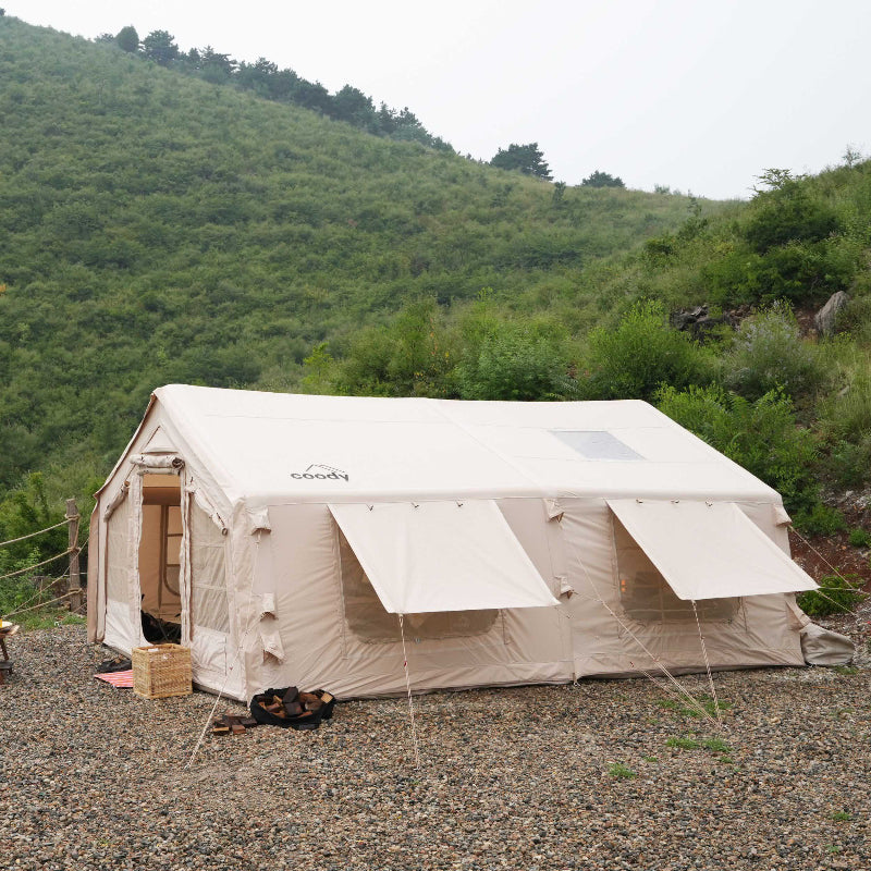 Coody 17.2 Koala-7 beige inflatable tent with rain fly and window awnings front side view.