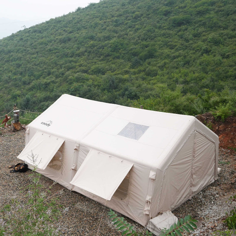 Coody 17.2 Koala-7 beige inflatable tent with rain fly and window awnings rear view.