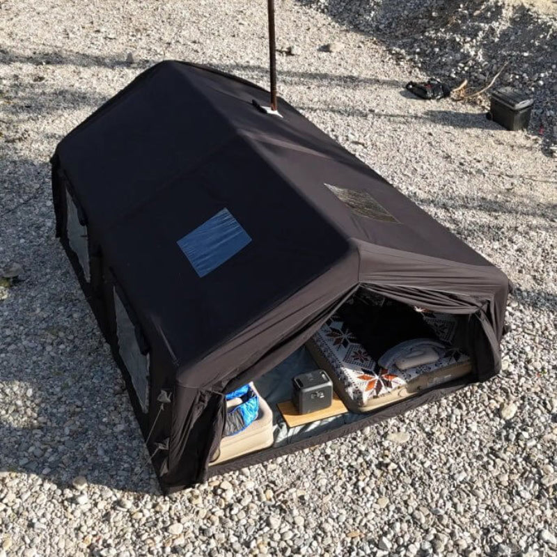 Coody 17.2 Koala-7 Black Inflatable Tent top view with furniture and stove pipe.