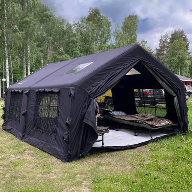 Coody 17.2 Large Inflatable Tent with cots in forest setting.
