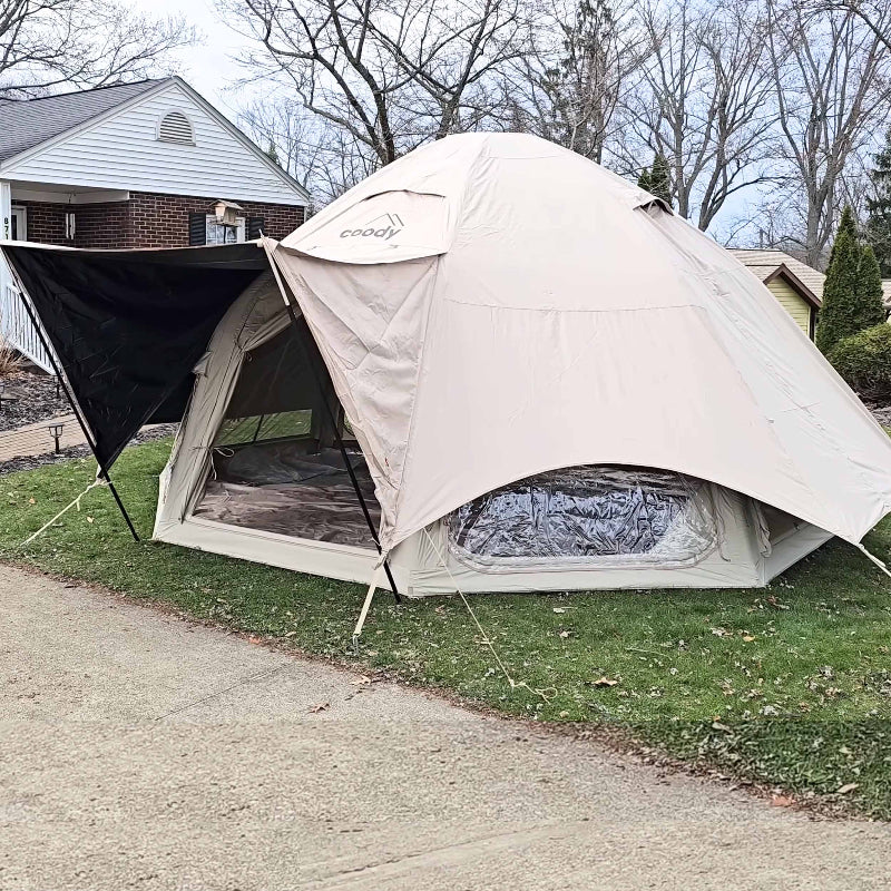 Coody Aurora Dome Inflatable Tent in beige with rain fly set up in yard.