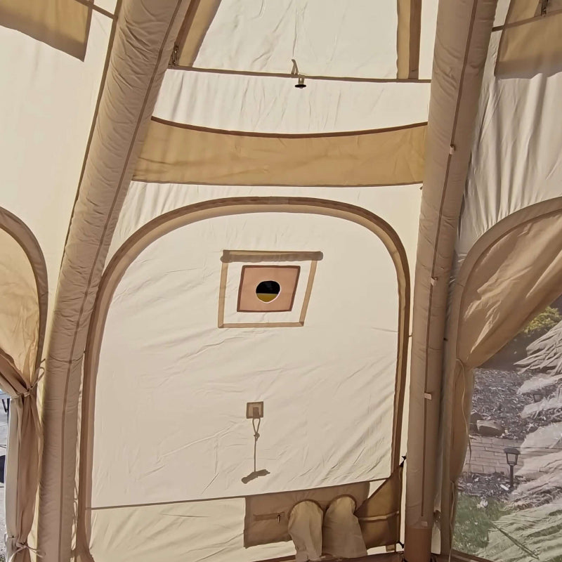 Coody Aurora Dome inflatable tent in beige stove jack view