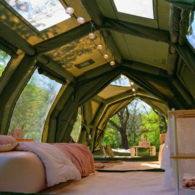 Coody Familia 17.2 Pro forest green inflatable tent interior living space with furniture. 