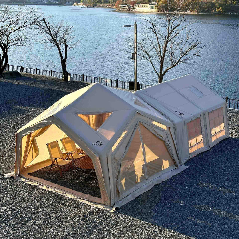 Coody Hub Shelter in beige attached to another inflatable Coody tent