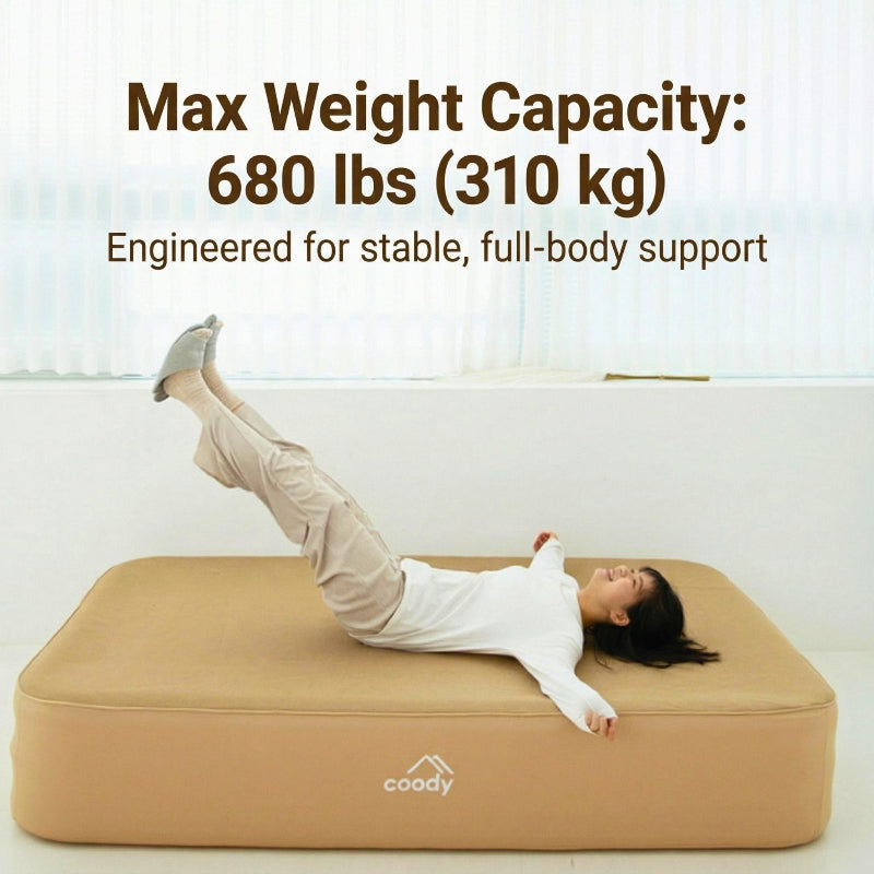 Coody air mattress in beige with woman lying on it, stable full-body support