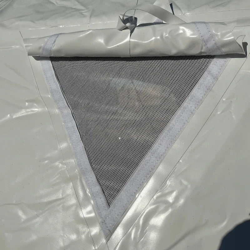 Wilderness Resource Dome 16 foot glamping tent, closeup of triangular mesh window with rain hood