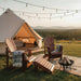 Treated Dark Knotted Pine 2 Position Classic Adirondack Footrest Ottoman in glamping setting
