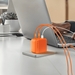 Jackery 102W GaN 3-Port Fast Charger demonstrating 100W blind plug-in charging home setup