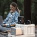 Jackery Explorer 300D compact portable power station charging devices at campsite